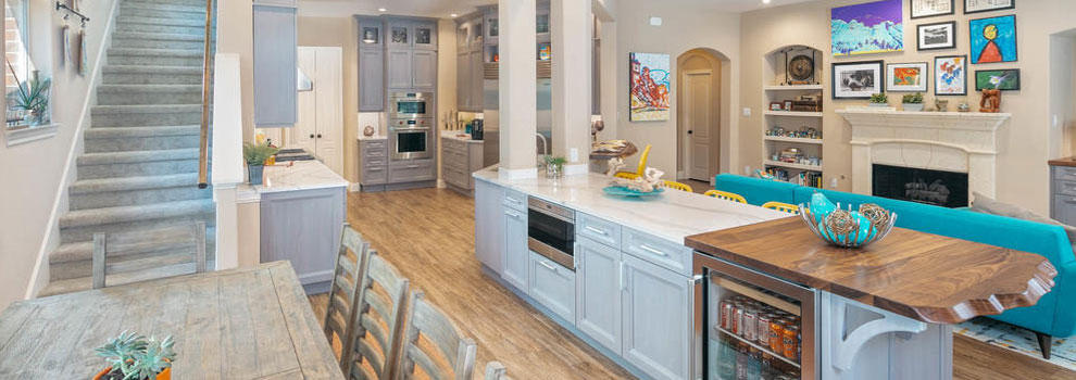 Gray Stained Walnut Cabinets And White Countertops Anchor This