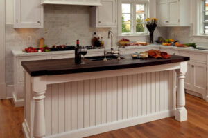 renovated kitchen with marble and wood countertops