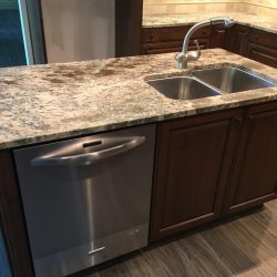 Not quite finished when these photos were taken, but it's going to be gorgeous, don't you think? Brand new custom Brookhaven cabinets, granite countertops, and all LED lighting (recessed cans and under-cabinet lights). Notice not electrical outlets in the backsplashes? They're concealed below the upper cabinets!