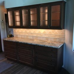 Not quite finished when these photos were taken, but it's going to be gorgeous, don't you think? Brand new custom Brookhaven cabinets, granite countertops, and all LED lighting (recessed cans and under-cabinet lights). Notice not electrical outlets in the backsplashes? They're concealed below the upper cabinets!