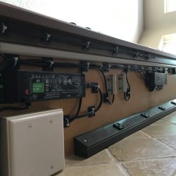 Detailed photo of intricate wiring of the cabinet interior lights, under-cabinet lights, and Angled Power Strips, all hidden under the hutch upper cabinets.