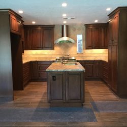 Not quite finished when these photos were taken, but it's going to be gorgeous, don't you think? Brand new custom Brookhaven cabinets, granite countertops, and all LED lighting (recessed cans and under-cabinet lights). Notice not electrical outlets in the backsplashes? They're concealed below the upper cabinets!