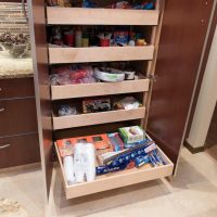 These roll-out shelves in the tall pantry offer maximum efficiency for storage, accessibility and flexibility. Each roll-out shelf is fully adjustable and full-extension.