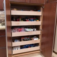 These roll-out shelves in the tall pantry offer maximum efficiency for storage, accessibility and flexibility.