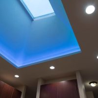 Crisp clean lines and warm colors come alive with the stunning LED color light display up in the skylight. The colors up in the skylight are ever-changing from one soft color to another. Brookhaven custom cabinets by Wood-Mode offer an abundance of storage amenities and sleek contemporary styling. The rich stained maple cabinet doors with aluminum edge-banding offer a unique option to ordinary slab doors & drawers. LED can lights and LED under-cabinet strips illuminate the kitchen, and clean, clutter-free backsplashes are made possible with the use of angled power strips below the upper cabinets.