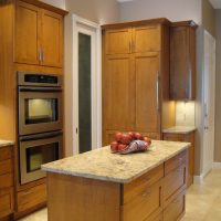 More drawers in the island for additional storage below this central work area, and the full-integrated Sub-Zero refrigerator blend beautifully and seamlessly within the cabinets.