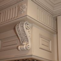 Heavy wood carvings adorn this massive commercial style hood.