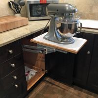 This mixer base provides sturdy support and easy storage of this heavy-duty mixer,along with storage for accessories on the roll-out shelf below.