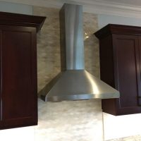 ×
Note that there are no unsightly outlets or switches in these beautiful backsplashes; all the outlets are cleverly concealed below the upper cabinets. Gorgeous Fusion quartzite countertops add excitement to the dramatic dark cherry cabinets.