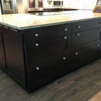 Even the back of the peninsula is packed with highly efficient drawer storage. Also note the angled power strip on the end of the peninsula, tucked neatly and conveniently below the countertop.