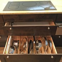 Among the 27 drawers in this kitchen is this extra-deep divided drawer that will accommodate 13