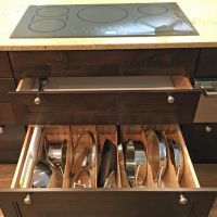 Among the 27 drawers in this kitchen is this extra-deep divided drawer that will accommodate 13