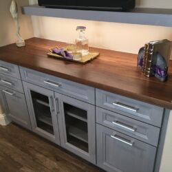 Gray cabinets with a wood Grothouse countertop.